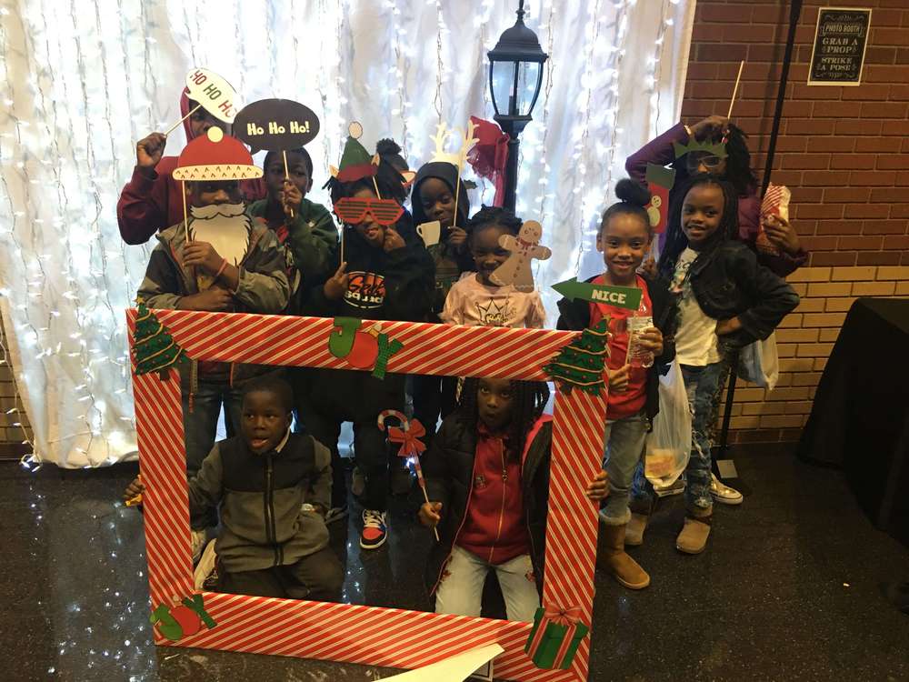 All kids crammed into photo with holiday frame prop