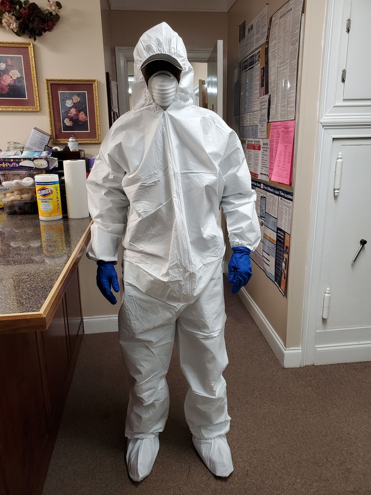 Staff member in full body PPE