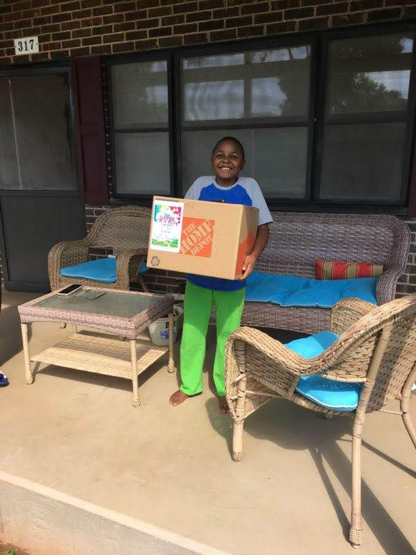 Kid holding his box