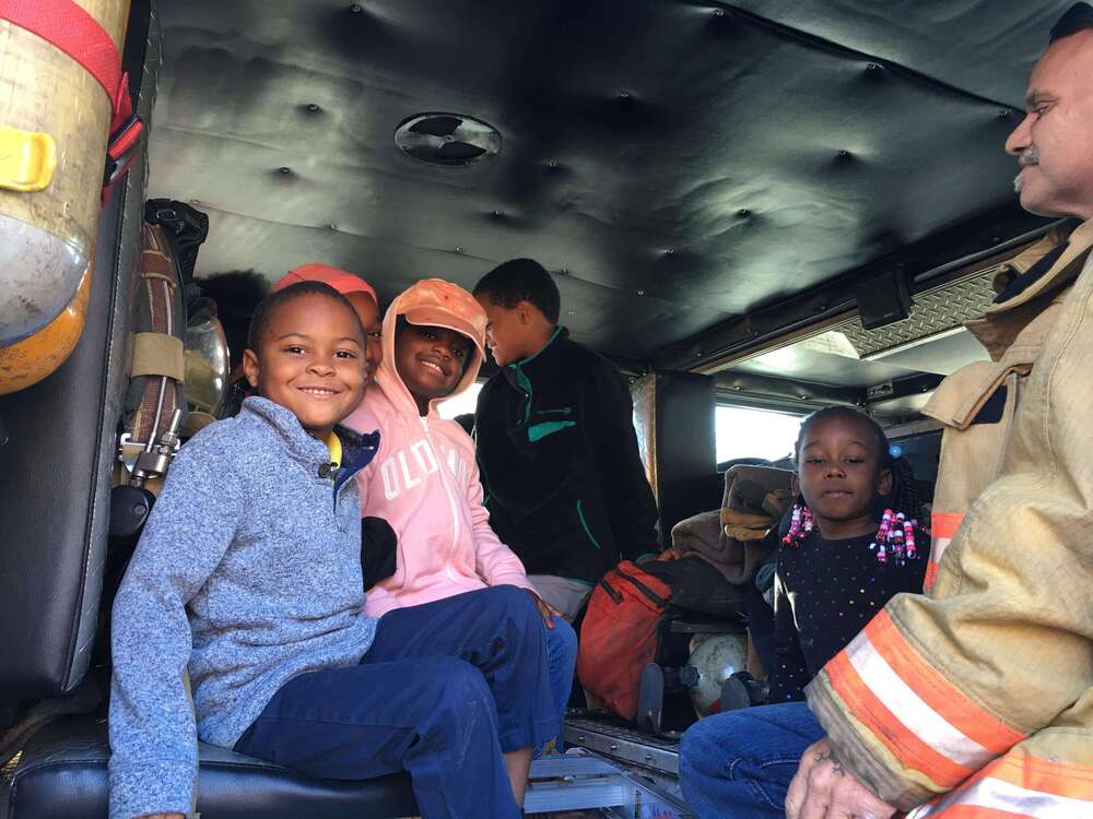 Kids sitting in fire engine