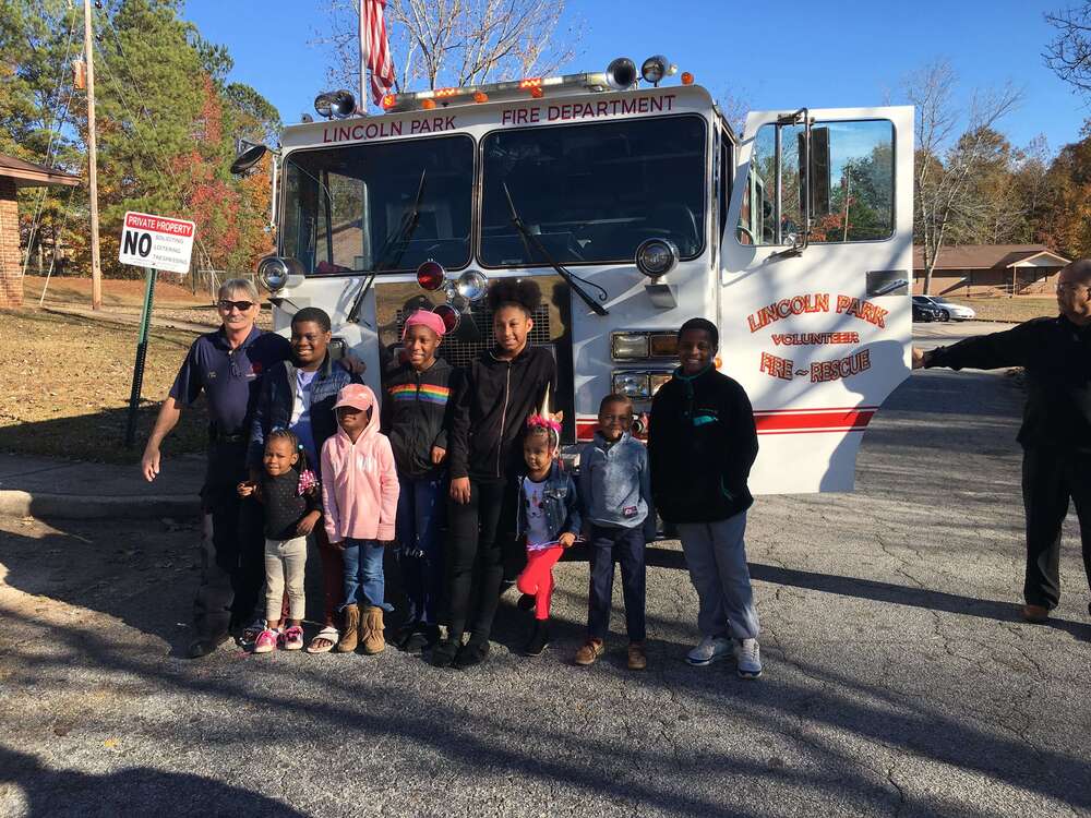 Group picture in front of fire truck