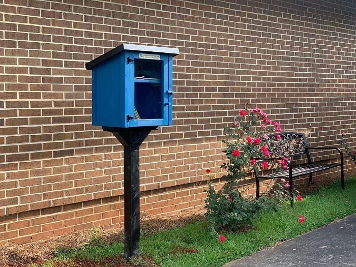 Little library with rose bush